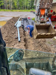 A man working on a construction site with a shovel.