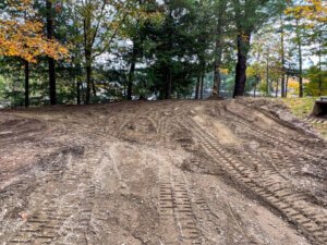 Tire tracks in the dirt at a gallery.