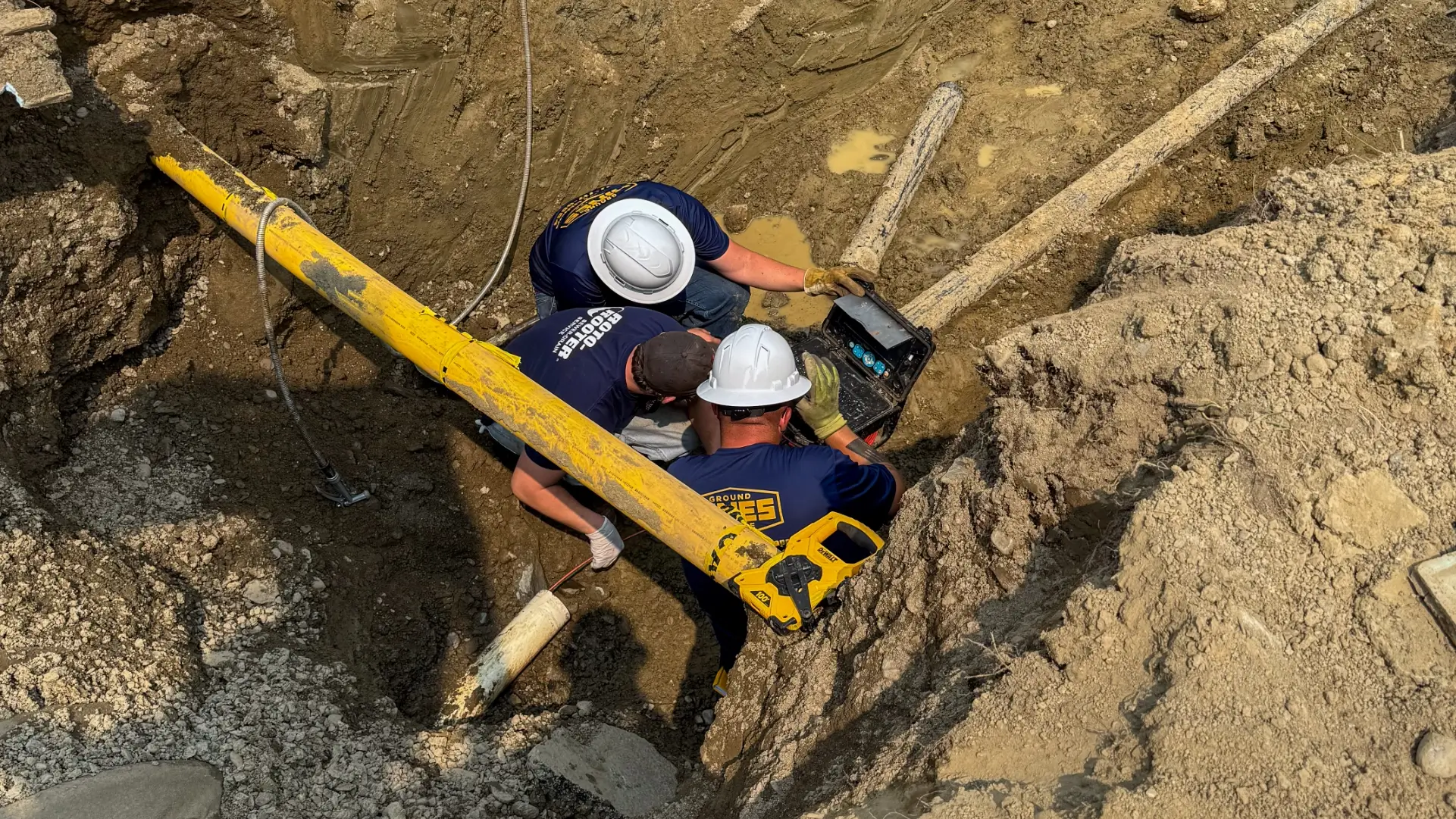 Photo of a Maine excavating team digging in the dirt